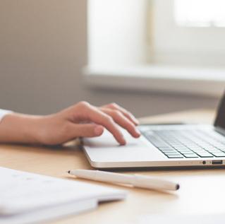 Hands using laptop computer